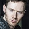 Anders Yates as Bank Employee