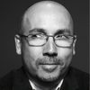 J. Miles Dale as Program Director