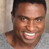 Michael-Leon Wooley as Ron Troupe (voice)
