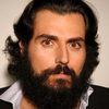 Sam Kalidi as Amin