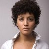 Anne Agbadou-Masson as The Belgian Woman
