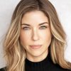 Devon Weigel as Traci Adams