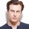 Noah Segan as Travis Levine