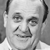 Douglas Håge as Nisse, janitor at the Opera