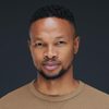 Theo Bongani Ndyalvane as Early Human