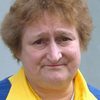 Bella Emberg as Woman at door