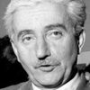 Pierre Prévert as Traveler in a Hurry (uncredited)