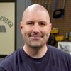 Greg White as Race Announcer