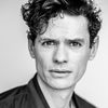 Aaron Jay Rome as Oz