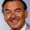 Bob Monkhouse as Space Navigator Brad Newman / Swinging Star Compere (voice)