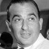 Raoul Lévy as John Bogus, the American