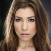 Kristin Kowalski as April