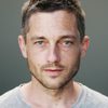 Volker Bruch as Lieutenant Becker