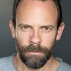 Keir Charles as Dom