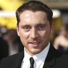 Ben Batt as John Anderson