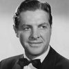 Robert Cummings as Johnny Reynolds Jr.