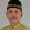 Afrizal Anoda as Ustadz Imam
