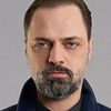 Ertan Saban as Customs Official