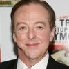 Edward Hibbert as Sir Michael Strickland