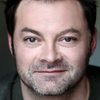 Emmanuel Gradi as Khan Karkass (Voice)