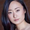 Katherine Oh as Funeral Guest 1