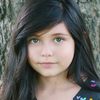 Ionie Olivia Nieves as Minnie (7 yo)