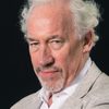 Simon Callow as The Reverend Mr. Beebe