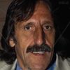 Massimo Buscemi as amico di Asso al bar