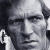 Neil McCarthy as Burton