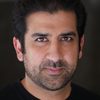 Ankur Bhatt as Cubicle Neighbour