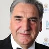 Jim Carter as Charles Carson
