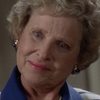 Charlotte Zucker as Woman with Program