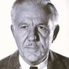 Sam Flint as G. Phipps, Bank Manager (Uncredited)