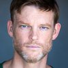 Brad Beyer as Dennis