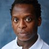 Kobna Holdbrook-Smith as Father Emery