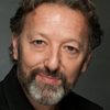 Ian Reddington as Bassett