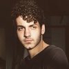 Ehren Kassam as Tommy Carlson
