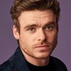 Richard Madden as John Reid