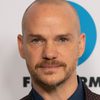 Peter Paige as Tim