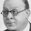Charles Paton as Tobacco Shop Proprietor