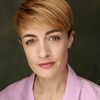 Hannah Chalmers as Travel Agent