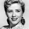 Joyce Holden as 'Tiny' Ford - Photographer