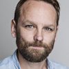 Jonathan Harden as The Interviewer (voice)