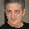 Frank Crudele as Ezra