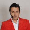 Andrés López as Elvis Antonio's Adult Voice
