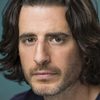 Jonathan Roumie as Viktor