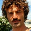Guido Caprino as Bernardo Bertolucci