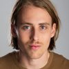 Devin Brochu as TJ