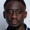 Ibrahim Koma as Leslie Konda