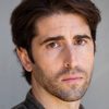 Aaron Kuban as Adrian